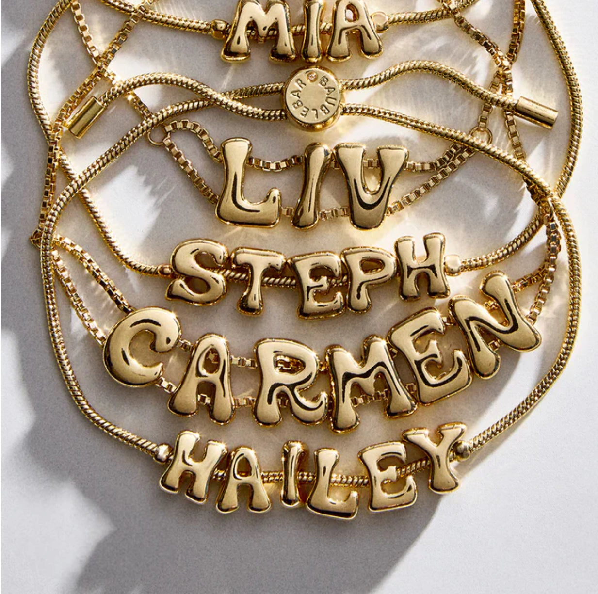 TWO BUBBLE LETTER BRACELETS